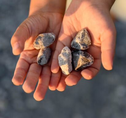 Hands holding rocks.