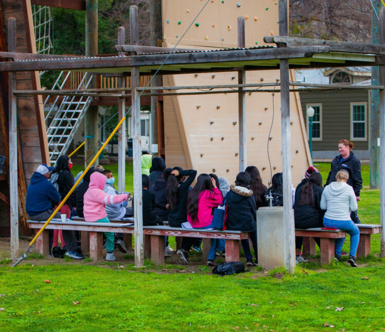 Campers learning about raft building.