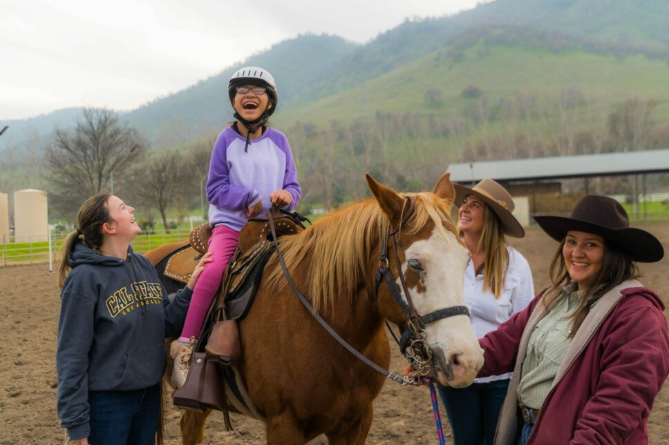 Camper riding a horse.