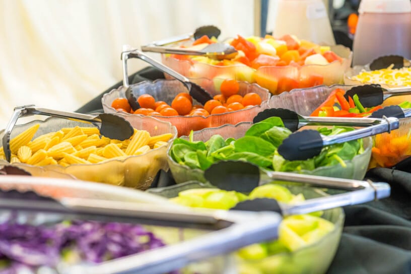 Bowls of salad items at the salad bar.