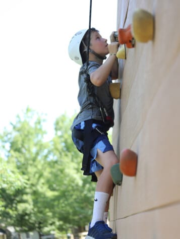 Boy rock climbing.