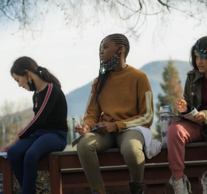 Campers leaning about edible plants.