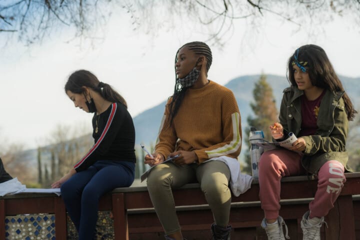 Campers leaning about edible plants.