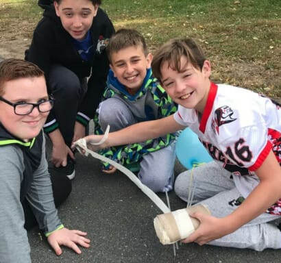 Campers working on an egg drop project.