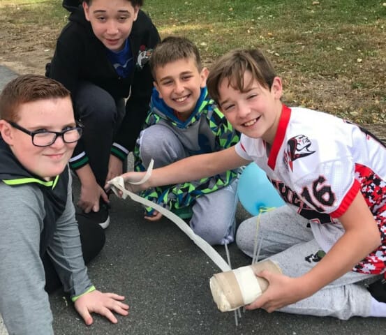 Campers working on an egg drop project.