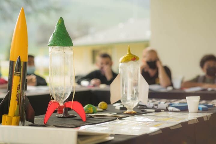 Campers making bottle rockets.