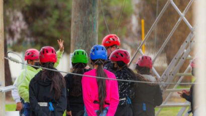Group of campers with helmets on.