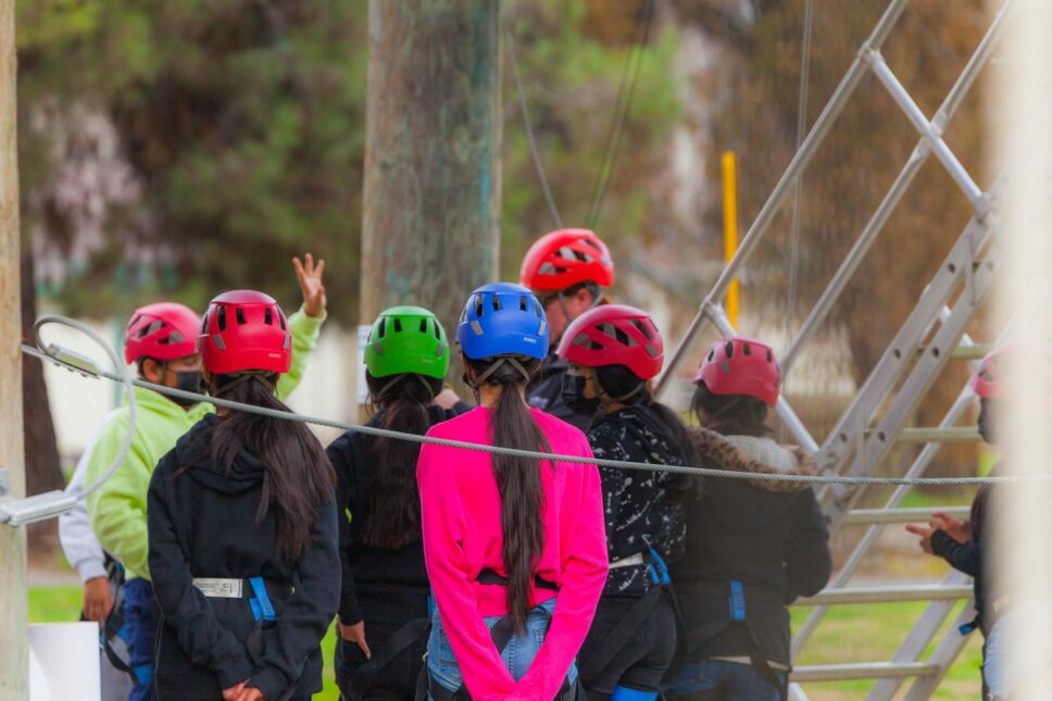 Group of campers with helmets on.